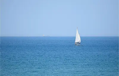 a sail boat in the middle of the ocean at Cozy Home In Partinico With Wifi in Partinico