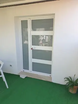 a room with a window and a green floor at CASA DEL SOLE in Alcamo