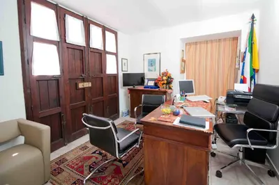 an office with a desk with a computer and chairs at Residence Il Capo in Palermo
