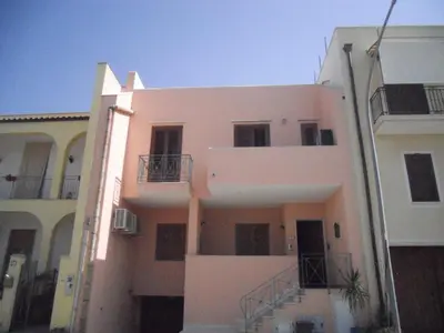a white building with balconies on the side of it at CASE COLOMBO E MATTARELLA by Trerose Properties - Appartamenti centrali con wi-fi e posto auto privato gratuito in San Vito lo Capo