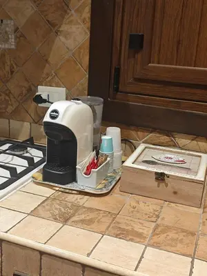 a mixer sitting on a counter next to a box at CASA MIKY in Palermo