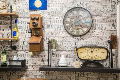 a clock is hanging on a wall with writing on it at Casale D' Or in Palermo