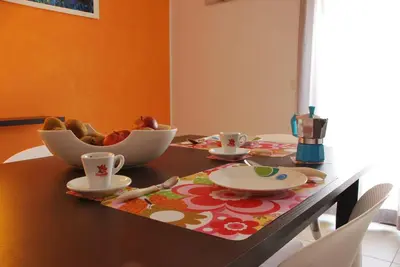a dining room table with a bowl of food on it at Case Vacanze Anni 20 in Bagheria