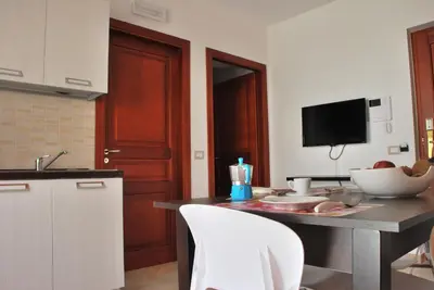 a kitchen with a table with a bowl of food on it at Case Vacanze Anni 20 in Bagheria