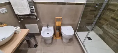 a bathroom with a toilet and a sink and a shower at Ballarò Guest House in Palermo