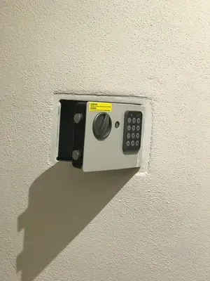 a remote control attached to the side of a wall at La Casetta Paternò “Nel Cuore Pulsante di Palermo” in Palermo