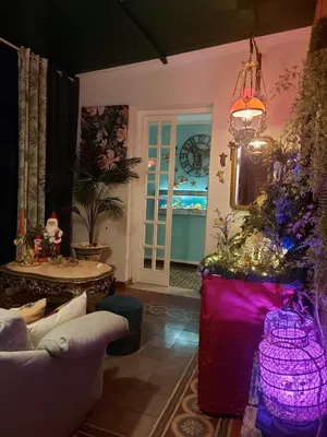 a living room with a christmas tree and a couch at LE VELE in Palermo
