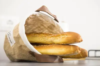 two donuts in a bag on a table at Sciabika Edificio Flowers in Castellammare del Golfo