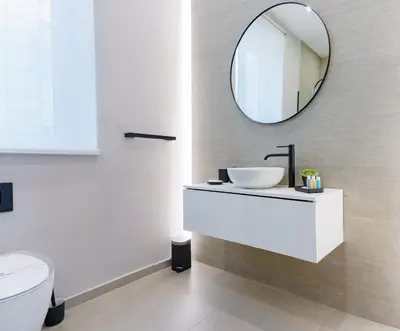 a bathroom with a sink and a mirror on the wall at Parlamento Apartment - Esclusivo 120mq centro storico Palermo in Palermo