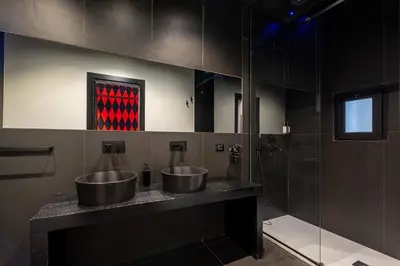 a bathroom with two sinks and a shower at Maximum hub suite&spa in Palermo