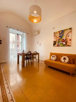 a living room with a couch and a table at Palermo Center Residenza IN Cattedrale Superior Apartment in Palermo