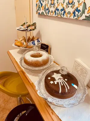 a table with two cakes on top of it at Palermo Center Residenza IN Cattedrale Superior Apartment in Palermo