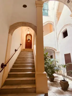 a staircase leading up to a building with a door at Palermo Center Residenza IN Cattedrale Superior Apartment in Palermo