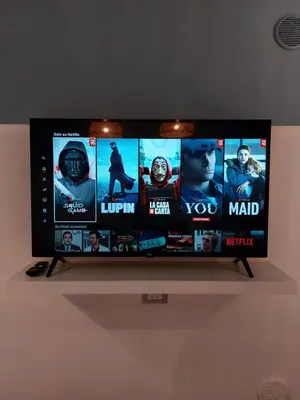 a flat screen tv on a stand on a wall at Piazza Mondello Lifestyle Home Palermo in Mondello
