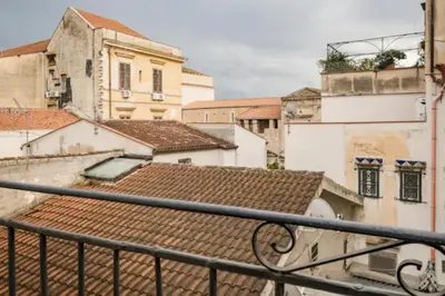 a view of roofs of buildings from a balcony at Tavola tonda apartament in Palermo