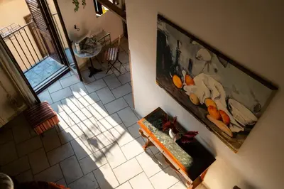 an overhead view of a room with a table and a picture at Panormus Cala a Mare by DomuSicily in Palermo