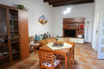 a kitchen and dining room with a table and chairs at N'Amuri di Casa in Palermo
