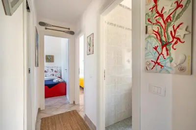 a hallway with a room with a bedroom at VILLA HIBISCUS in Castellammare del Golfo