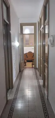an empty hallway with a bed in a room at Manzoni rooms in Palermo