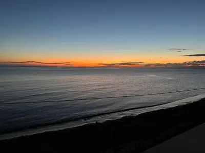 a view of the ocean at sunset at Villa GLORIA intero alloggio sulla spiaggia 8 posti letto 15 minuti da Palermo e 35 da Cefalu in Casteldaccia