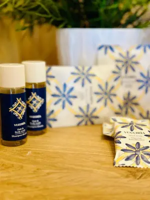 two bottles of essential oils sitting on a table at Case Vanella Grande aspra bagheria in Bagheria