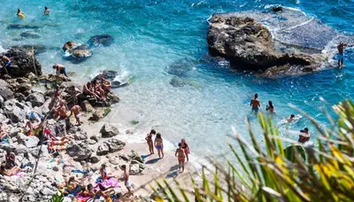 a group of people on a beach in the water at CASE VANELLA GRANDE aspra Bagheria in Bagheria