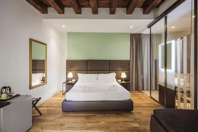 a room with a shower with a bed in it at PALAZZO SANTAMARINA Luxury Suite & Spa in Palermo