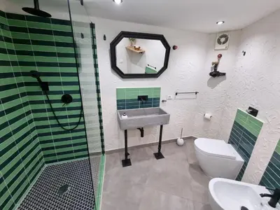 a bathroom with a sink and a shower and a toilet at Casa Monviso Le fuoriserie in Palermo