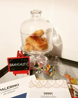 a bowl of food in a glass jar on a table at Residenza Tarzanà in Palermo