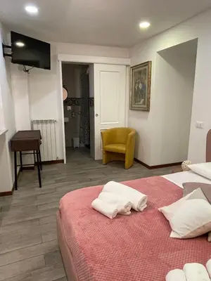 a bedroom with a bed with two towels on it at Posto al Capo in Palermo
