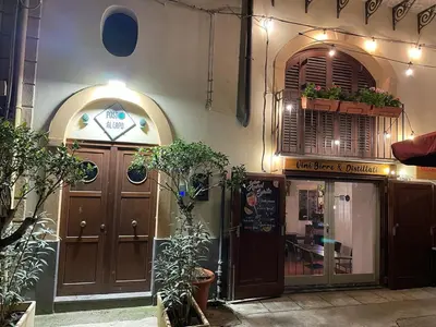 a building with a restaurant with plants in front of it at Posto al Capo in Palermo