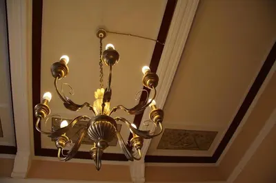 a chandelier hanging from a ceiling in a room at A Casa di Anna - Apartment in Palermo
