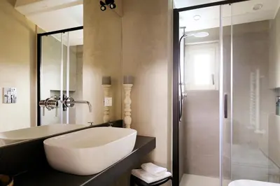 a bathroom with a tub and a sink and a shower at Sui Tetti di Balarm Boutique Rooms in Palermo