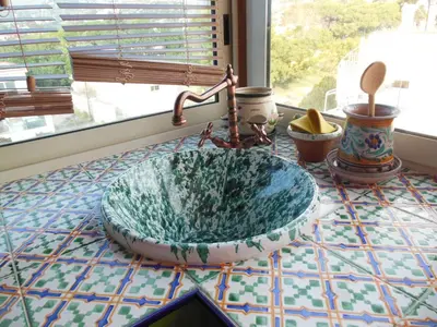 a glass sink on a counter with a window at Casa Lunastella Locazione Turistica in Mondello