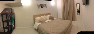 a bedroom with a bed with white sheets and pillows at 100 PASSI in Palermo