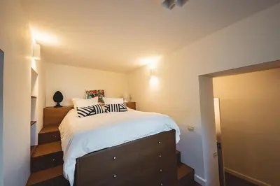 a bedroom with a large bed with zebra pillows on it at ChiChi Home in Palermo