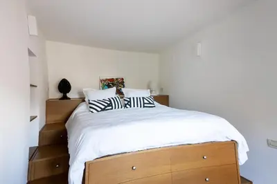 a bedroom with a bed with two pillows on it at ChiChi Home in Palermo