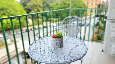 a small plant sitting on a table on a balcony at Garibaldi Rooms 29 - Piazza Marina a Palermo - In pieno Centro. in Palermo