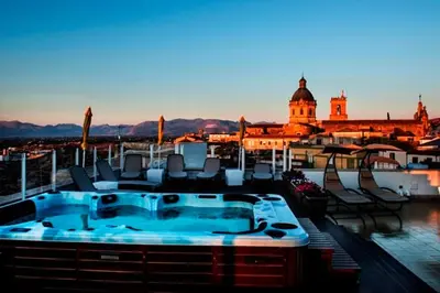 a hot tub on the roof of a building at Hotel Centrale Spa & Relax in Alcamo