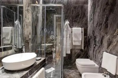a bathroom with a sink and a toilet and a shower at Grand Hotel Et Des Palmes in Palermo
