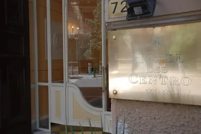 a window of a hotel del genore sign in a store at Hotel del Centro in Palermo