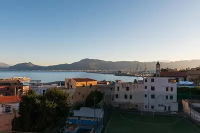 a view of a city with a tennis court at Casa de Paoli - Vista Mare Arenella, Palermo con Parcheggio Privato in Palermo
