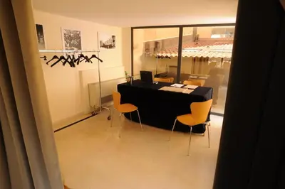 a room with a table and chairs and a window at Ucciardhome Hotel in Palermo