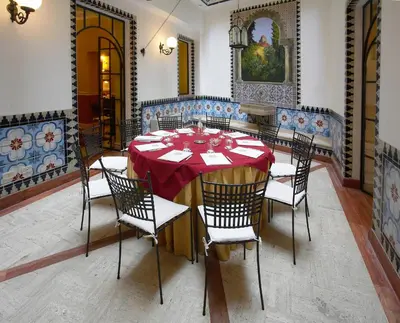 a dining room with a table and chairs at Best Western Ai Cavalieri Hotel in Palermo