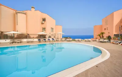 a large swimming pool in front of a building at Mono 2 in Lido di Mondello