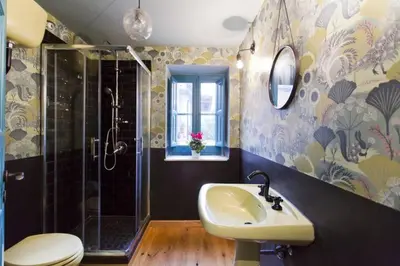 a bathroom with a sink and a shower and a toilet at Casa del Vinile in Palermo