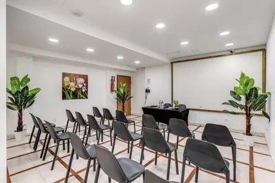 a room with chairs and a grand piano at Casena Dei Colli, Sure Hotel Collection By Best Western in Palermo