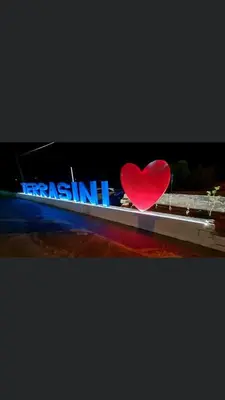 a red heart is sitting on top of a sign at Civic03 B&B in Terrasini
