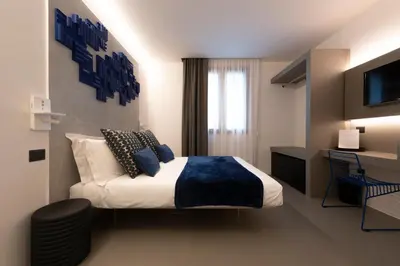 a hotel room with a bed and a television at Civic03 B&B in Terrasini