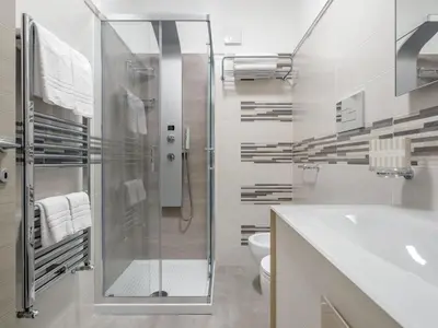 a bathroom with a shower and a toilet and a sink at Apartment Palermo by Interhome in Balestrate